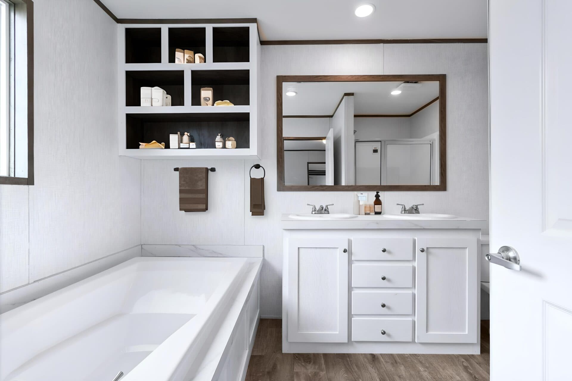Bathroom with tub and double vanity in the Jackson