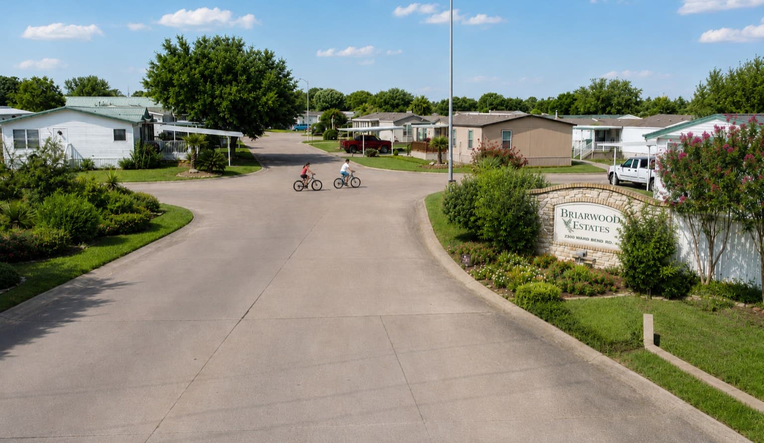 Tree-lined street in the Briarwood Estates manufactured home community